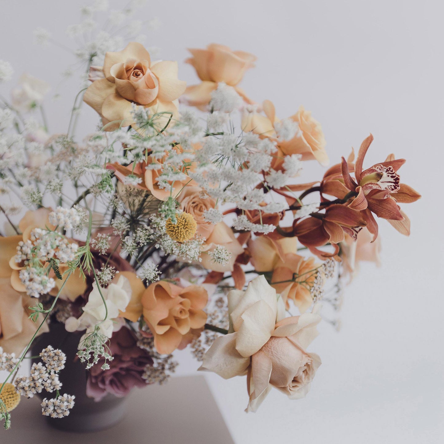 Muted pastel colours for a modern luxury flowers in a stunning vase and bouquet arrangement featuring Roses and Ammi and Sweet-peas from Edinburgh florist Aspen Florals