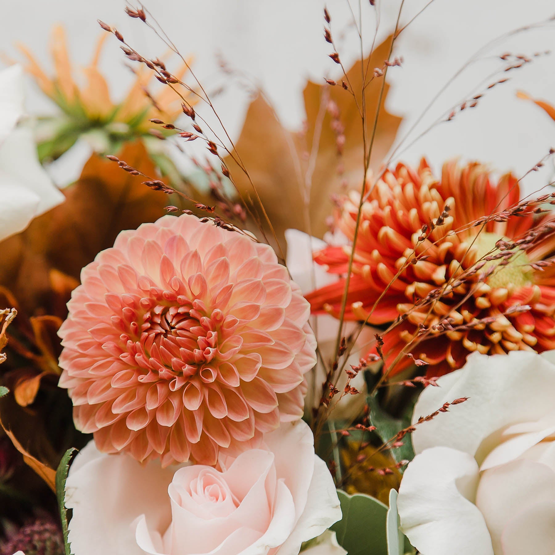 This beautiful seasonal bouquet with a soft autumn palette, dahlias, sunflowers, rudbeckias and large roses from Edinburgh Florist Aspen Florals 